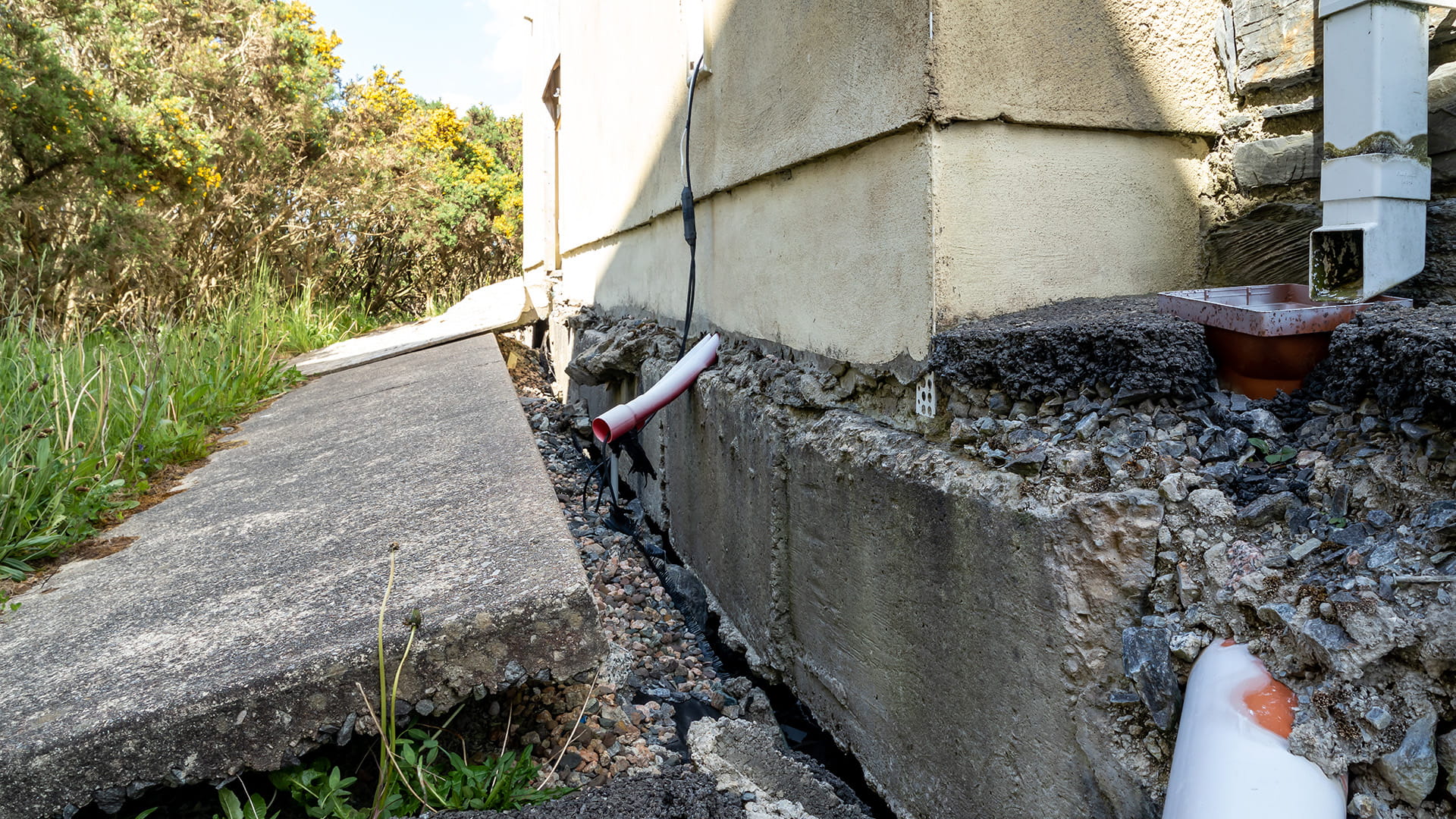broken pipes due to subsidence of building on a peatbog