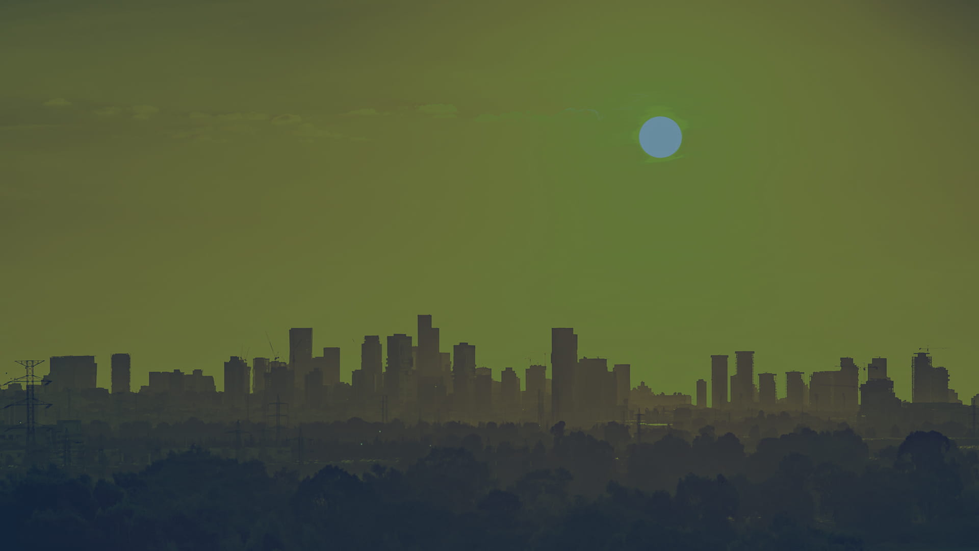 skyline panorama of a city bathed in sunshine on a hot day