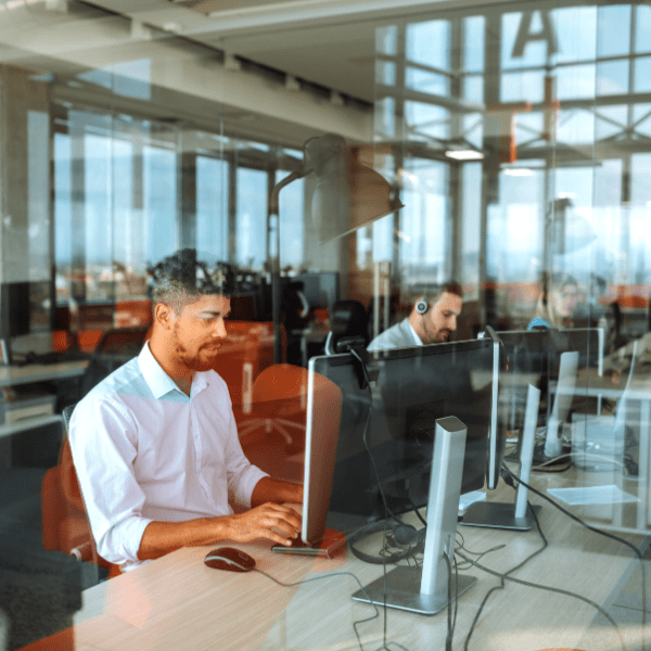 Contact centre workers sitting at their desks