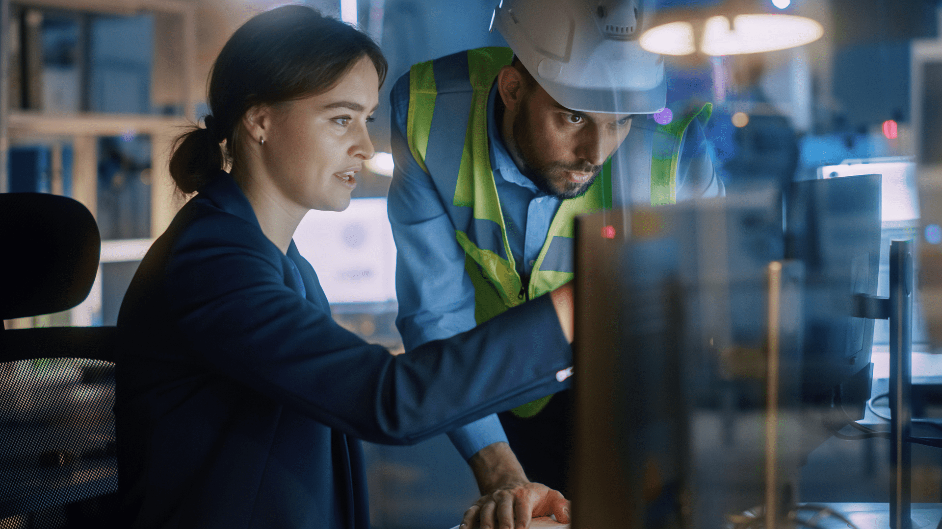 Two engineers discuss simulation modelling results