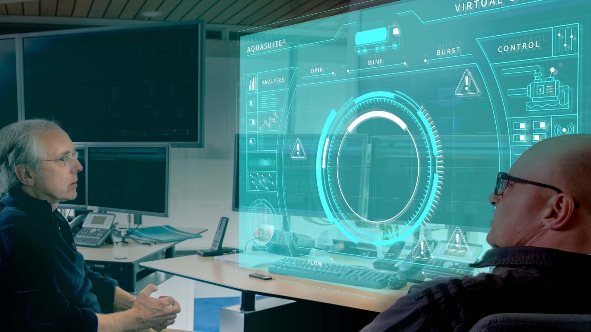 Two man looking at a screen disucussing the topic