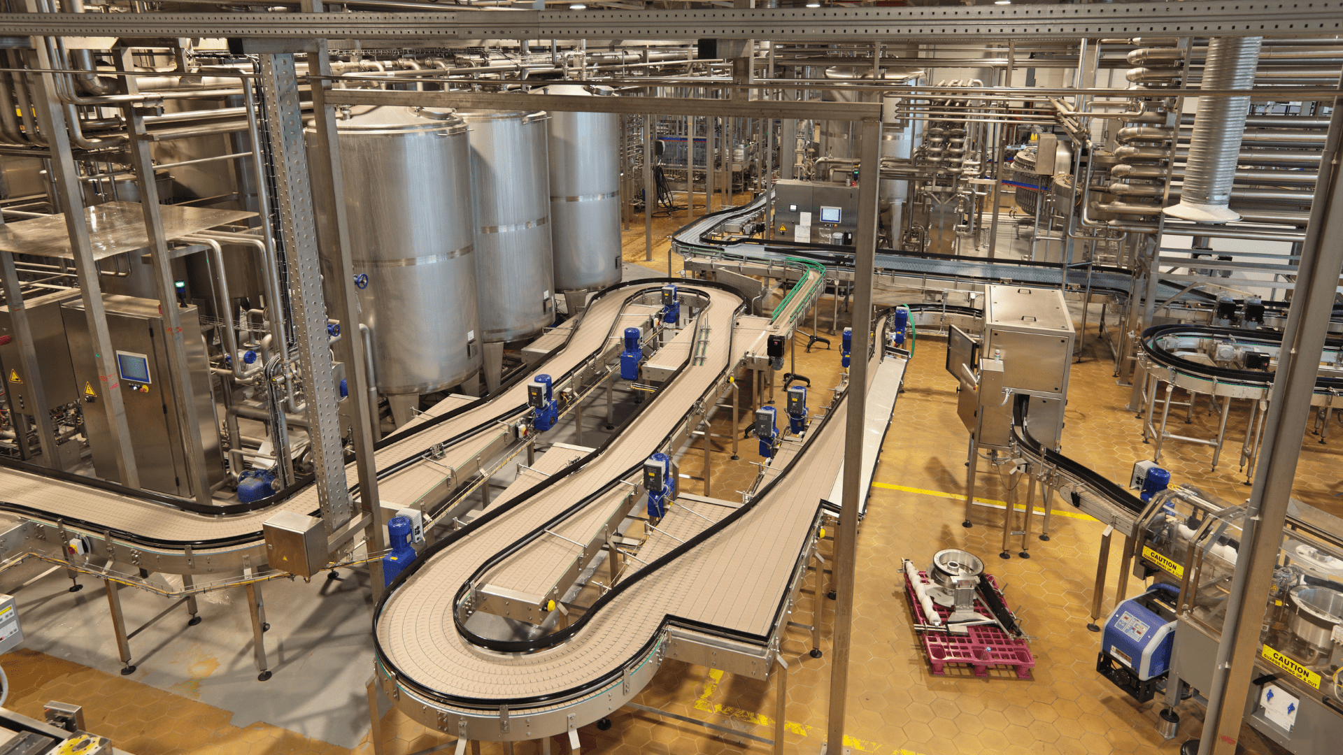 Conveyors inside a food and beverage plant.
