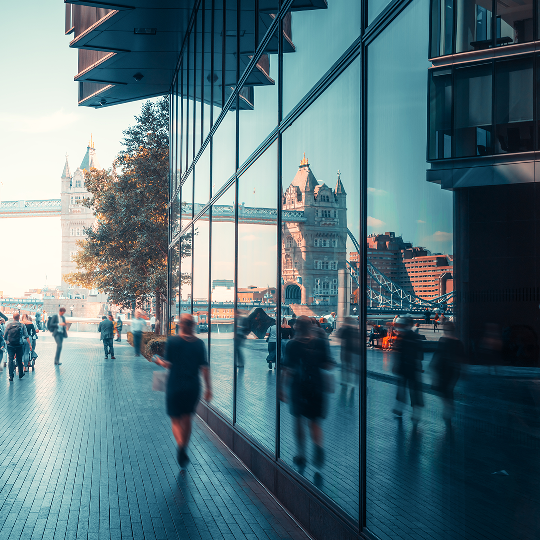city workers walk outside offices in the city